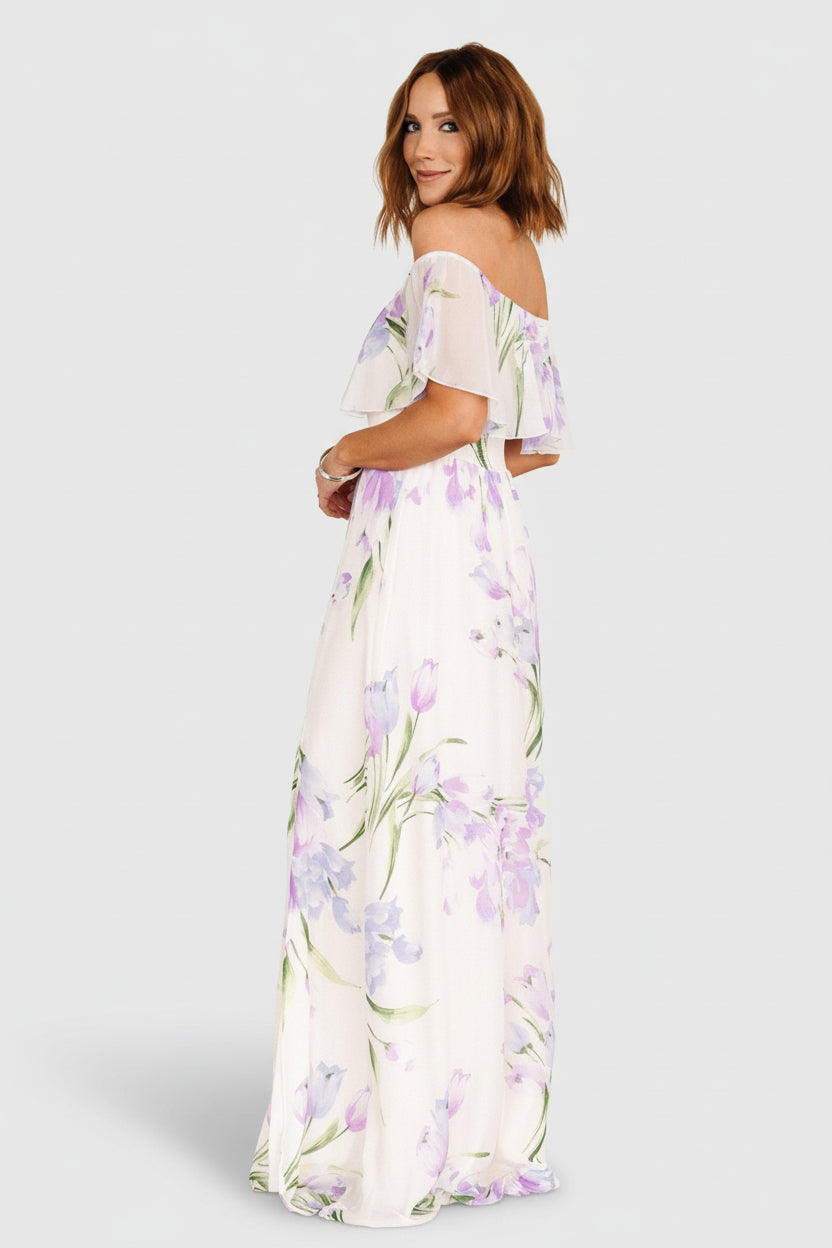 Back view of Daphne off-shoulder maxi dress highlighting fully lined skirt and elastic ruffle detail across the neckline and shoulders.