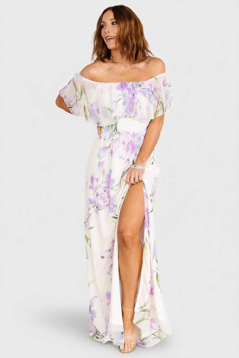 Fabric detail of the chiffon layers and floral print on the Daphne dress, showing color variation and delicate texture.