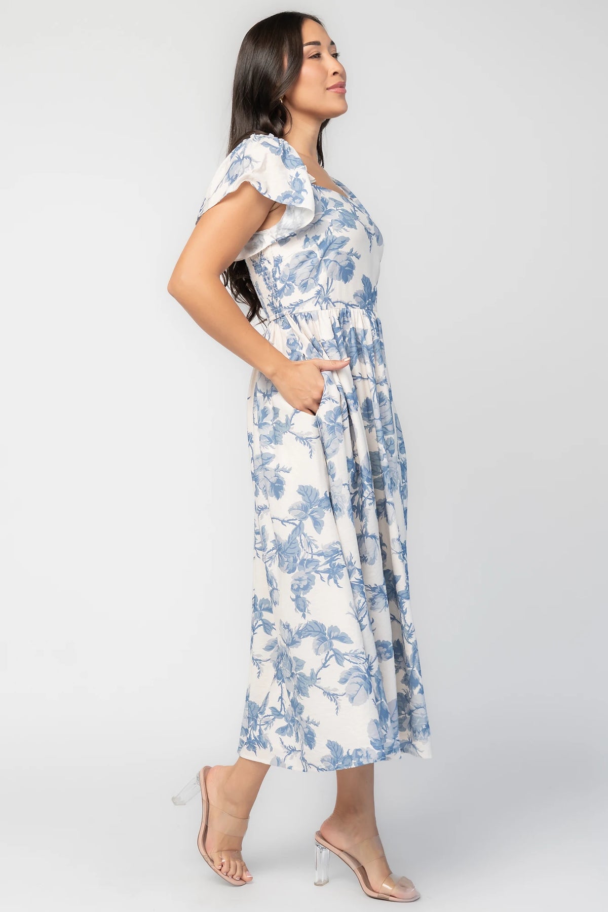 Darlene Dress in Ivory and Blue Floral with square neckline, flutter sleeves, and fit-and-flare midi skirt.