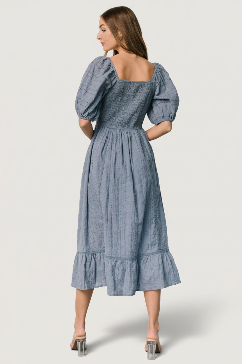 Hidden side pocket and front lining detail on dusty blue Delaney dress, showing pocket opening and lined skirt to mid-thigh.