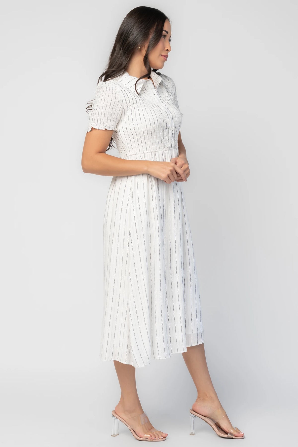 Dottie Striped Midi Dress in Off White with navy vertical stripes, collared neckline, button front, and A-line skirt.