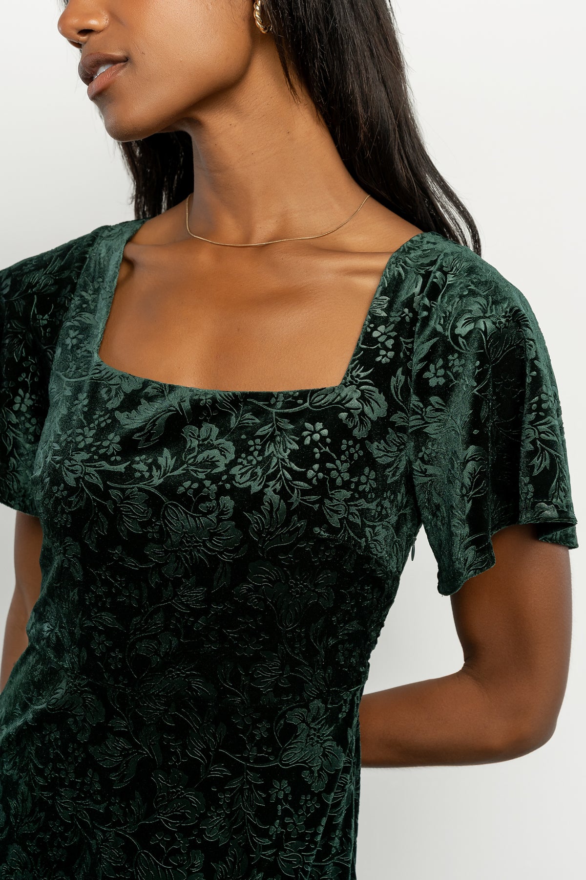 Eirene Burnout Velvet Maxi Dress in Emerald with floral velvet texture, square neckline, flutter sleeves, and tiered maxi skirt.