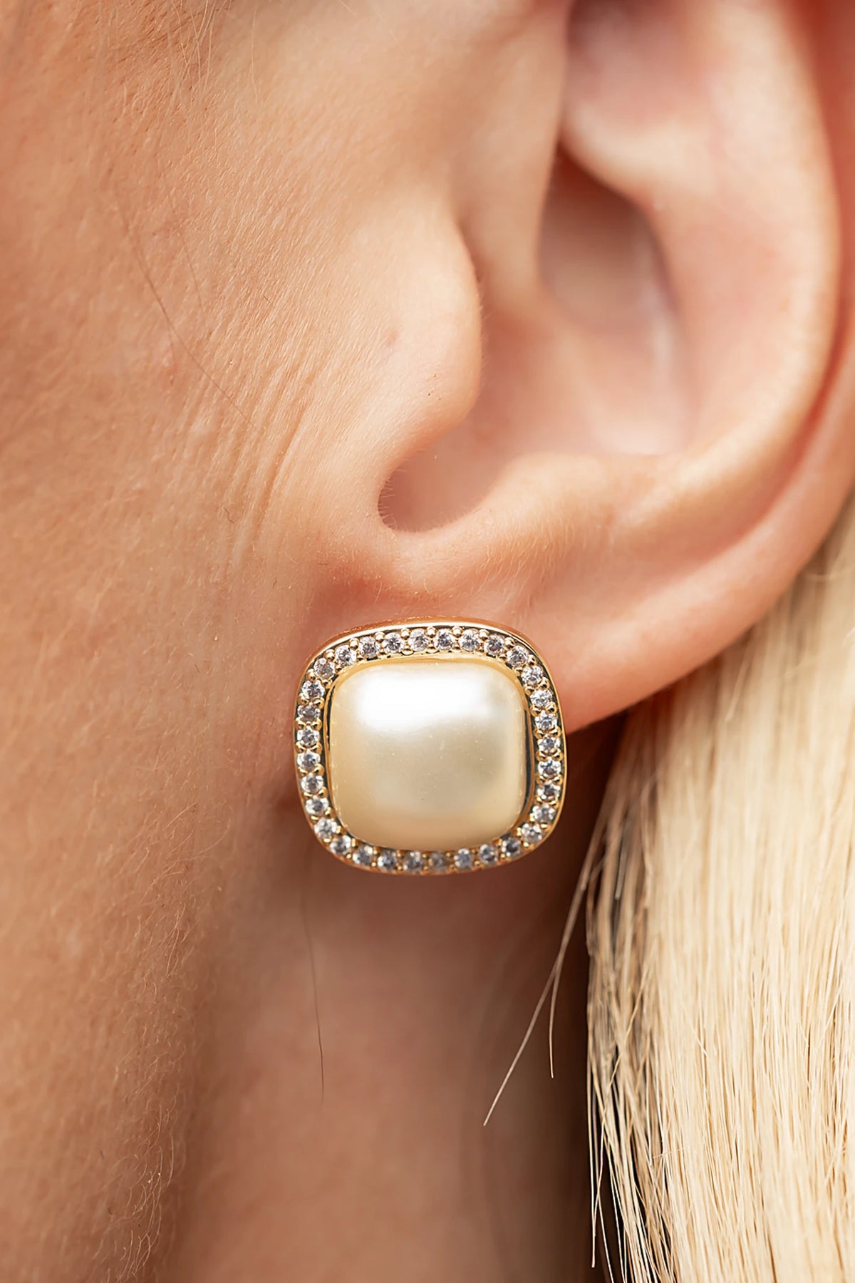 Elianna Pearl Stud Earrings in Gold with square pearl centers, clear stone borders, and polished gold-tone finish.