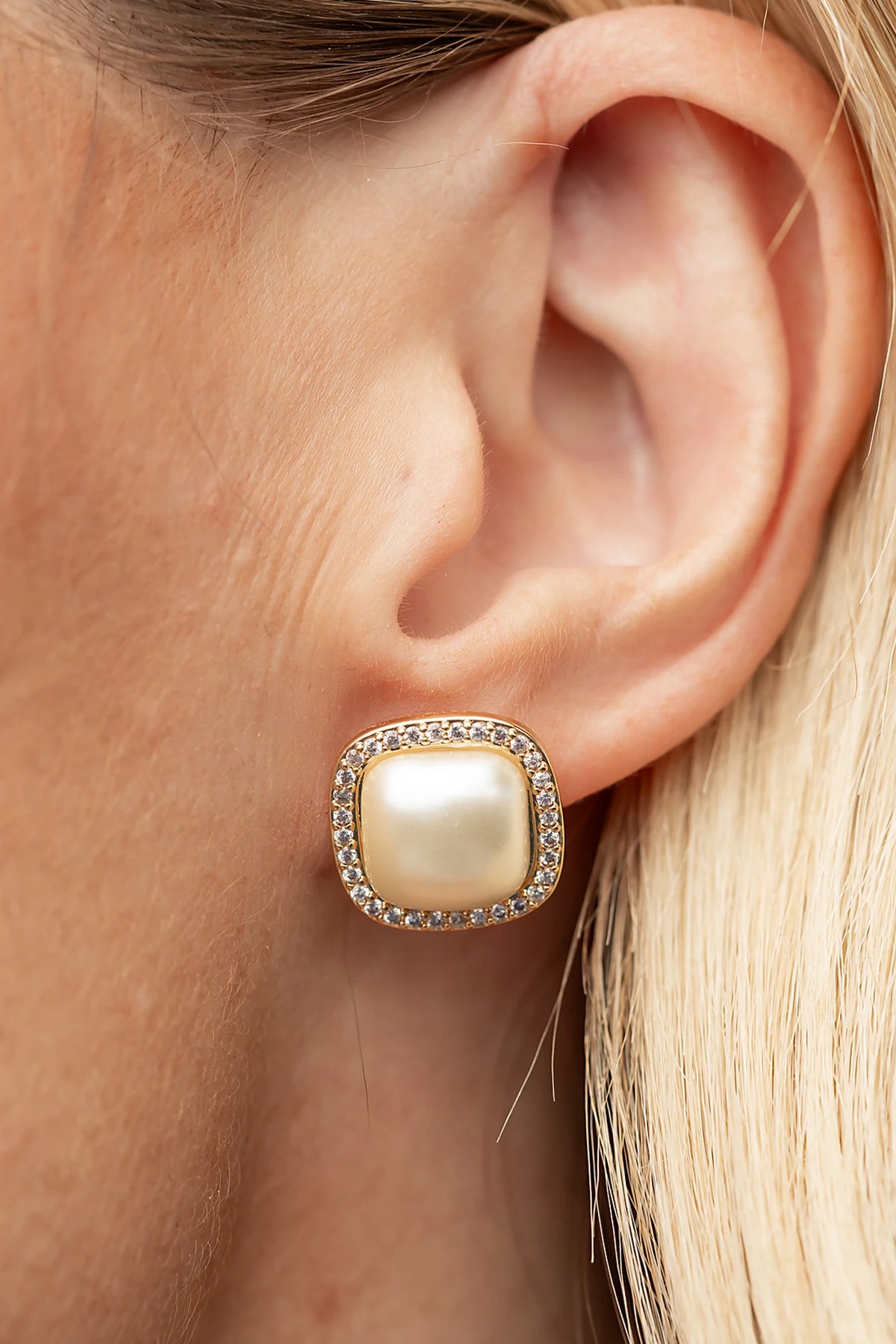Elianna Pearl Stud Earrings in Gold with square pearl centers, clear stone borders, and polished gold-tone finish.