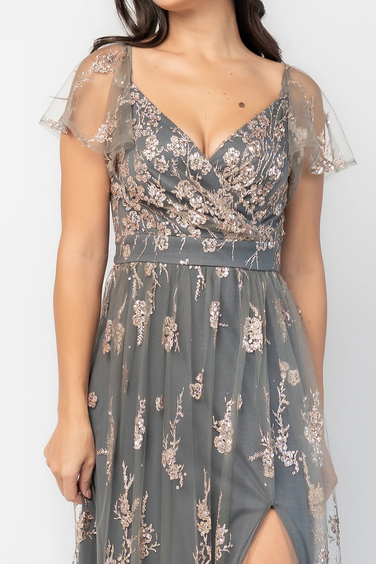 Esmerelda Shimmer Gown in Dark Sage + Rose with floral sequin embroidery, surplice V-neckline, flutter sleeves, and front slit.