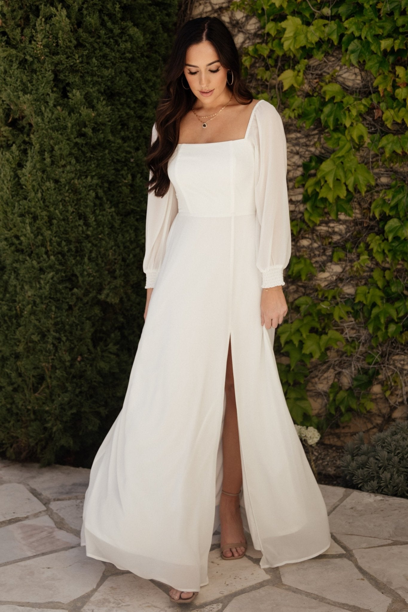 Close-up of smocked back bodice and neckline on white chiffon Giselle maxi dress highlighting texture and fit.