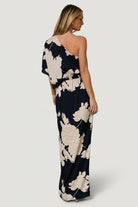 Styled flat-lay and drape detail of the navy-and-cream fabric, showing print placement and soft polyester texture for evening wear.