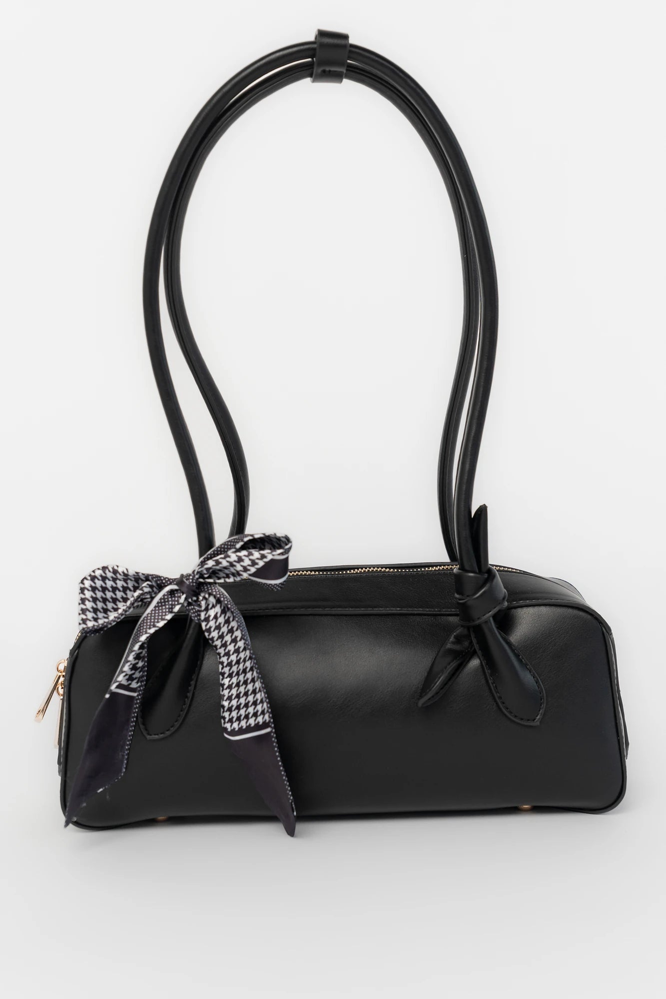 Harmony Mini Shoulder Bag in Black with gold zipper hardware, removable bow, shoulder strap, and interior pockets.