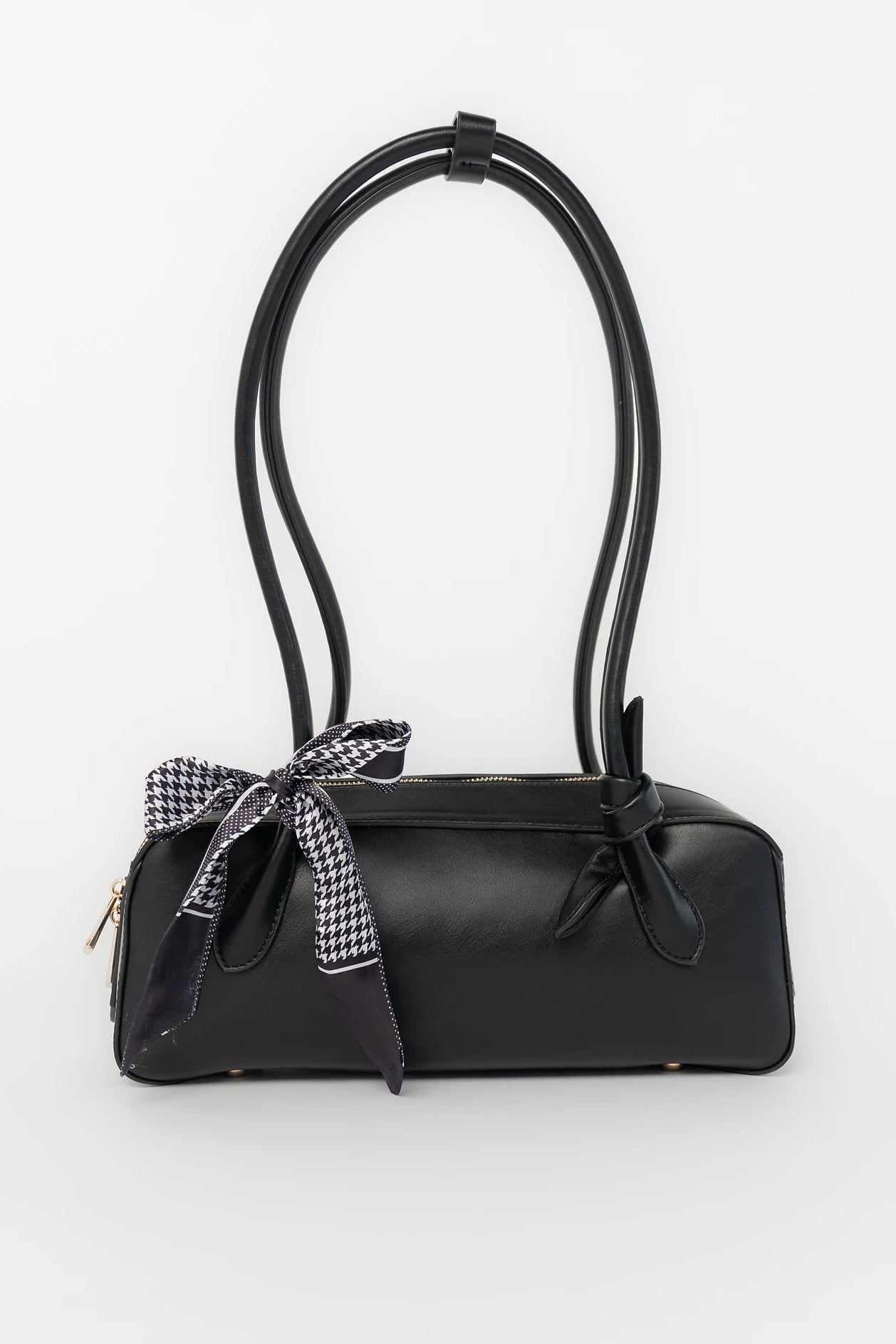 Harmony Mini Shoulder Bag in Black with gold zipper hardware, removable bow, shoulder strap, and interior pockets.