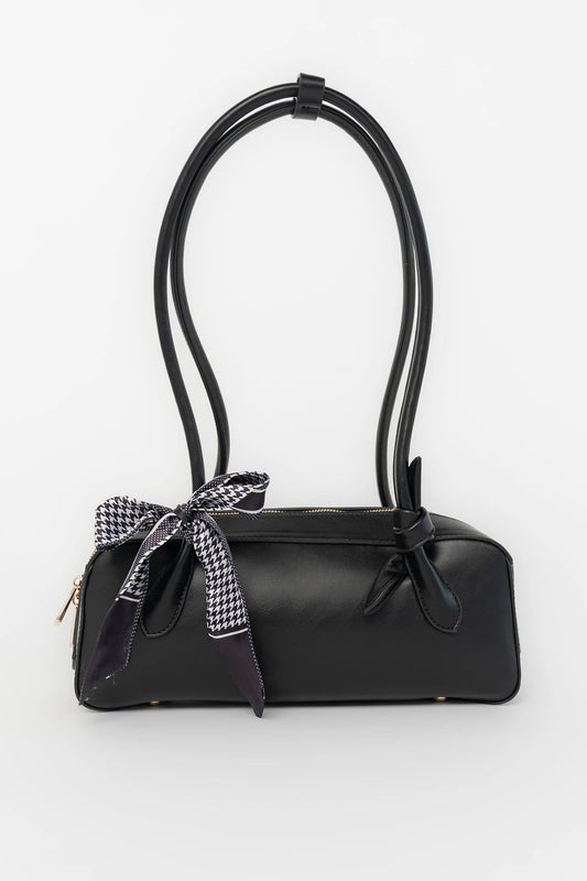 Harmony Mini Shoulder Bag in Black with gold zipper hardware, removable bow, shoulder strap, and interior pockets.