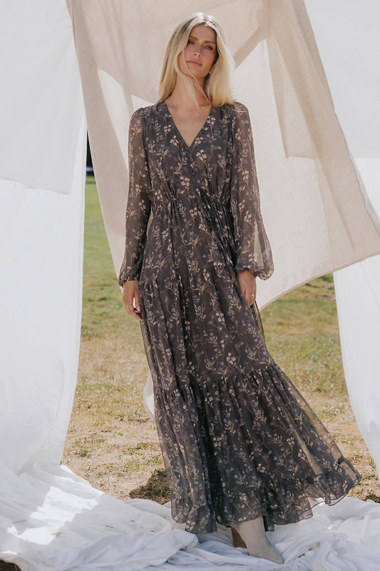 Hazel Boho Maxi Dress in Dusk Floral with V-neck, sheer long sleeves, drawstring waist, and tiered skirt.