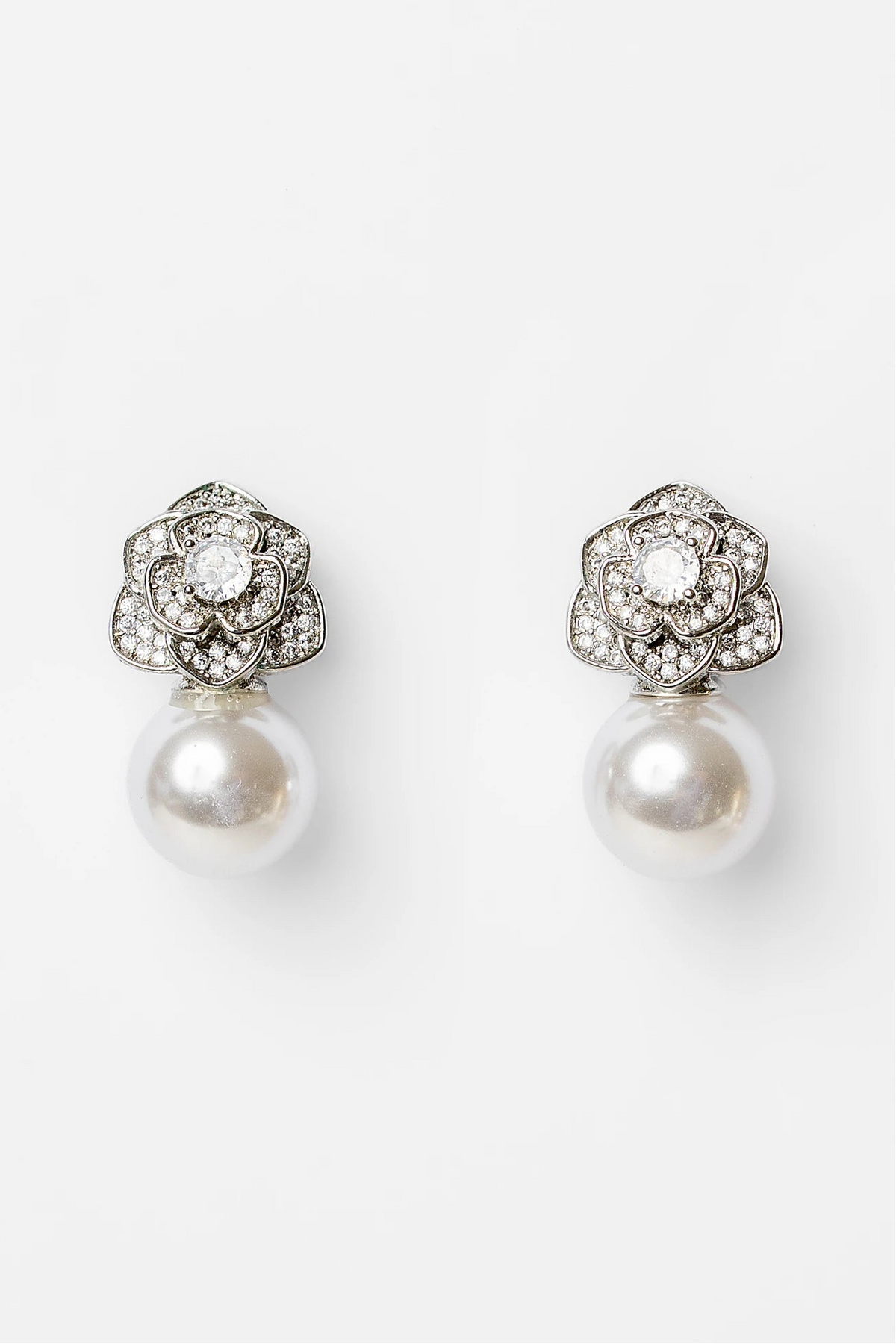 Helena Floral Pearl Drop Earrings in Silver with floral cubic zirconia studs and faux pearl drop.