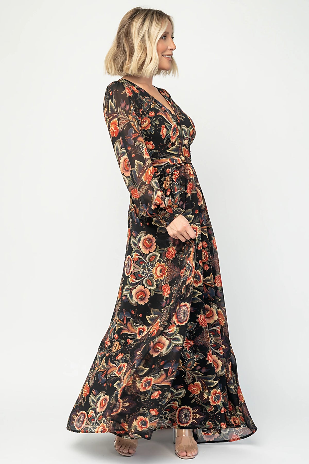Hera Maxi Dress in Black Multi Print with deep V-neckline, long sleeves, gathered waist, and smocked back.