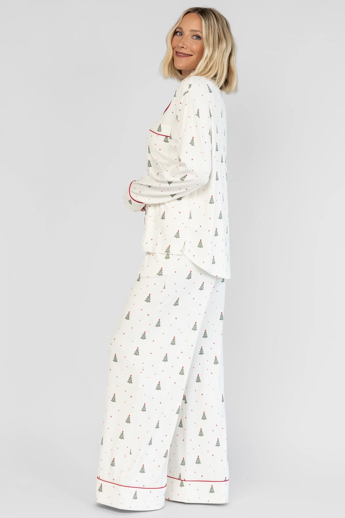Holiday Cozy Rib Knit Pajamas in Ivory + Evergreen with an evergreen tree print, button-front top, and contrast red piping.