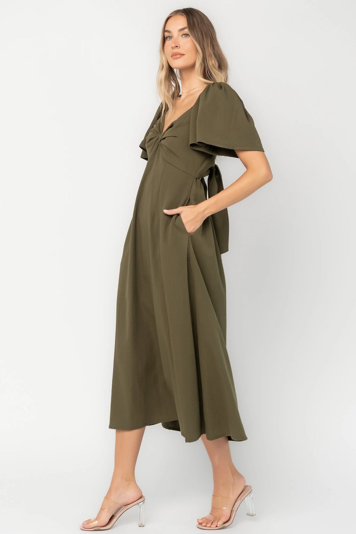 Indie Back Tie Dress in Olive with sweetheart neckline, butterfly sleeves, open tie-back, and side pockets.