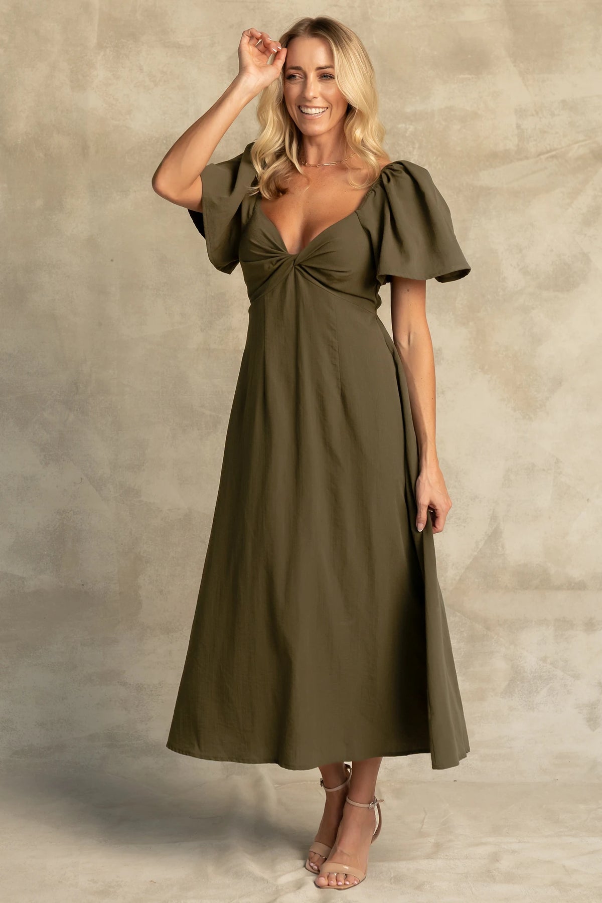 Indie Back Tie Dress in Olive with sweetheart neckline, butterfly sleeves, open tie-back, and side pockets.