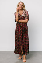 Detail of the left-leg slit and partially lined skirt on the Irina Velvet Maxi Dress in black multi floral, illustrating movement.