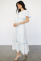 Back and side view of Janie midi dress showing gathered shoulders, short flutter sleeves, and tiered skirt with slit.
