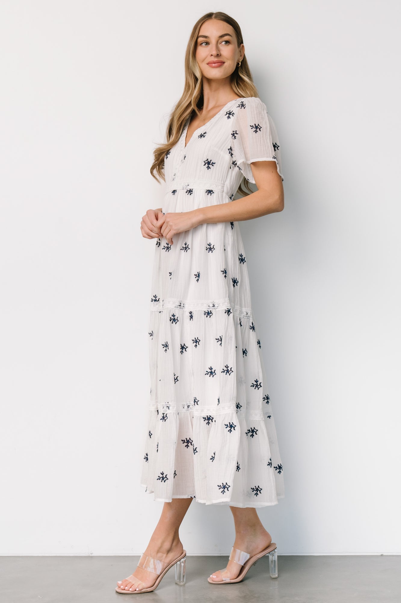 Back view of Jesenia midi dress showing elasticized waist and hidden side zipper for a comfortable, adjustable fit.