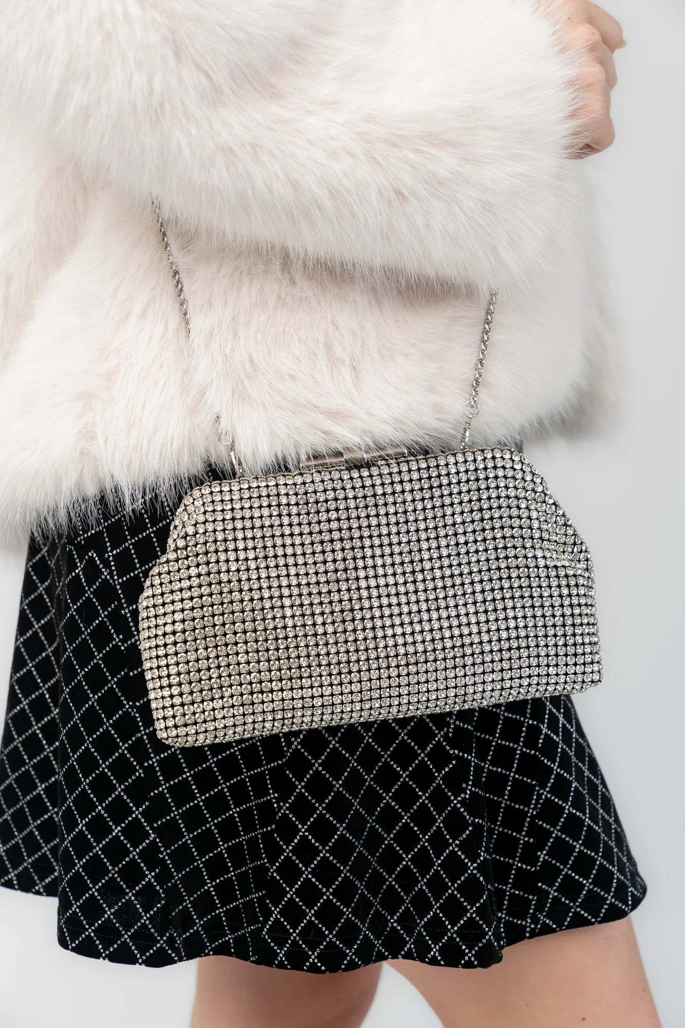 Julie Evening Clutch Bag with silver rhinestones, structured silhouette, clasp closure, and detachable chain strap.
