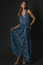 Close-up of bodice and smocked waist on Kamila Tulle Maxi Dress, showing fabric texture, deep V-neckline, and delicate floral pattern details.