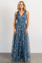 Front view of Kamila Tulle Maxi Dress in Blue Multi Floral on model, showing deep V-neck, smocked waist, and flowing tulle skirt, formal look.