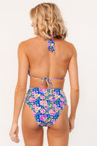 Close-up view of blue multi floral bikini bottom showing front knot, fabric texture and soft stretch construction with full lining.