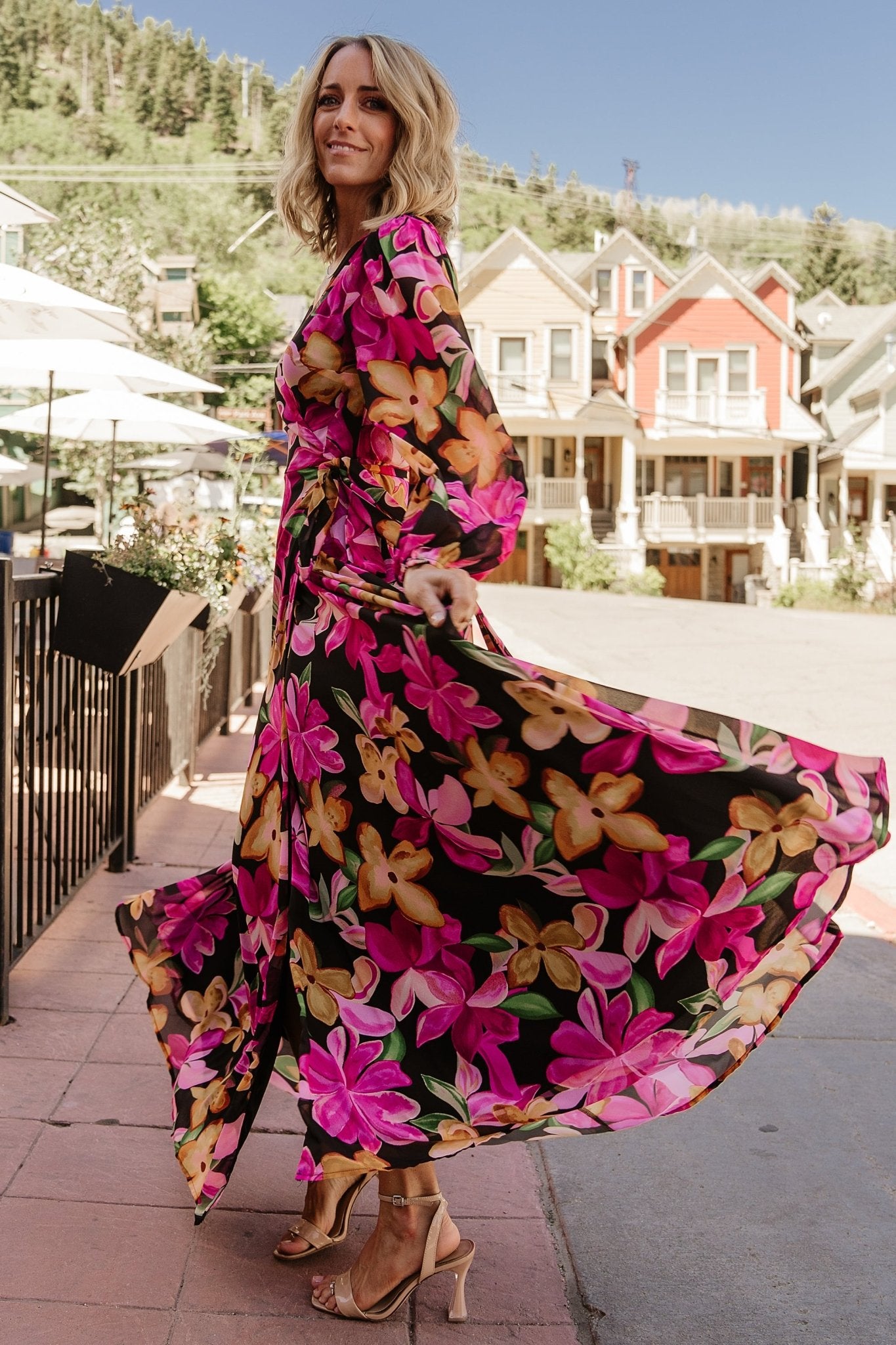 Close-up of the Katinka Wrap Maxi Dress fabric and print showing multicolored floral pattern on lightweight chiffon and delicate drape.