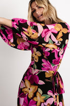 Side view of the Katinka Wrap Maxi Dress illustrating the flowing maxi skirt, wrap silhouette, and natural movement of the chiffon fabric.