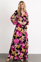 Product flat-lay of the Katinka Wrap Maxi Dress showing the Black Multi Floral pattern, wrap panels, and fabric texture in clear detail.