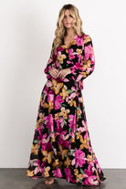 Close view of the Katinka Wrap Maxi Dress waist tie and surplice neckline, emphasizing the adjustable wrap design and feminine shape.