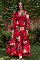 Side profile of Katinka Wrap Maxi Dress in burgundy multi floral showing long bishop sleeve with elastic cuff and gentle skirt drape.