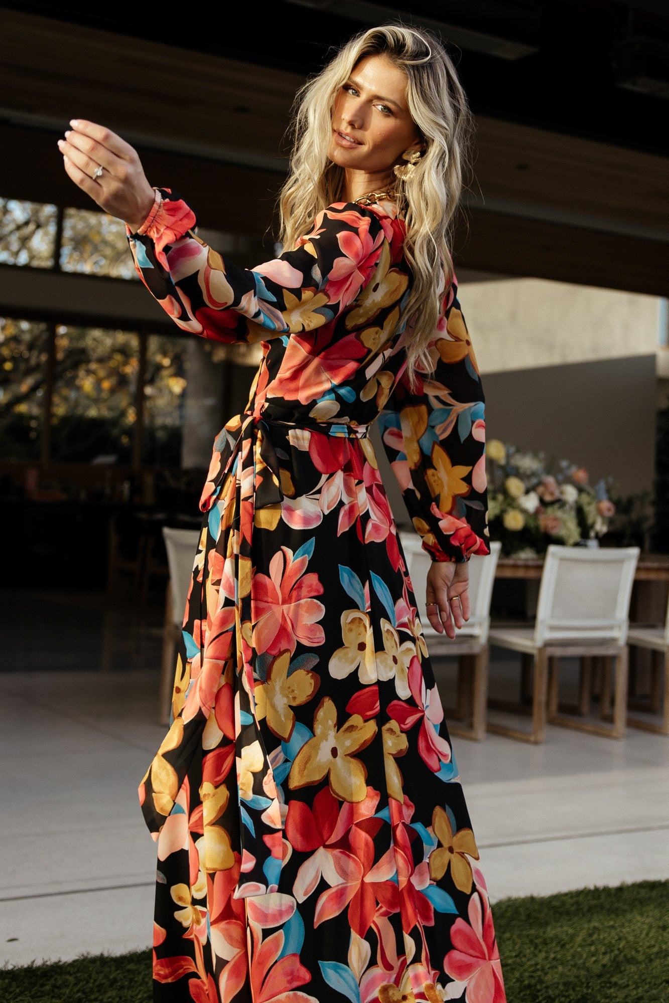 Waist tie and surplice neckline focus on the Katinka Wrap Maxi Dress, illustrating the adjustable wrap closure.