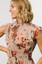 Close-up of the blush vintage floral print and lightweight polyester chiffon texture with subtle ruffle trimming at the sleeve.