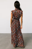Detail image of the chiffon fabric and floral pattern, showing print scale and the fully lined body versus unlined sleeves.