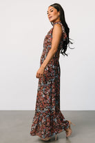 Back view showing smocked high neckline with button closures and the pull-over design of the brown multi floral maxi dress.