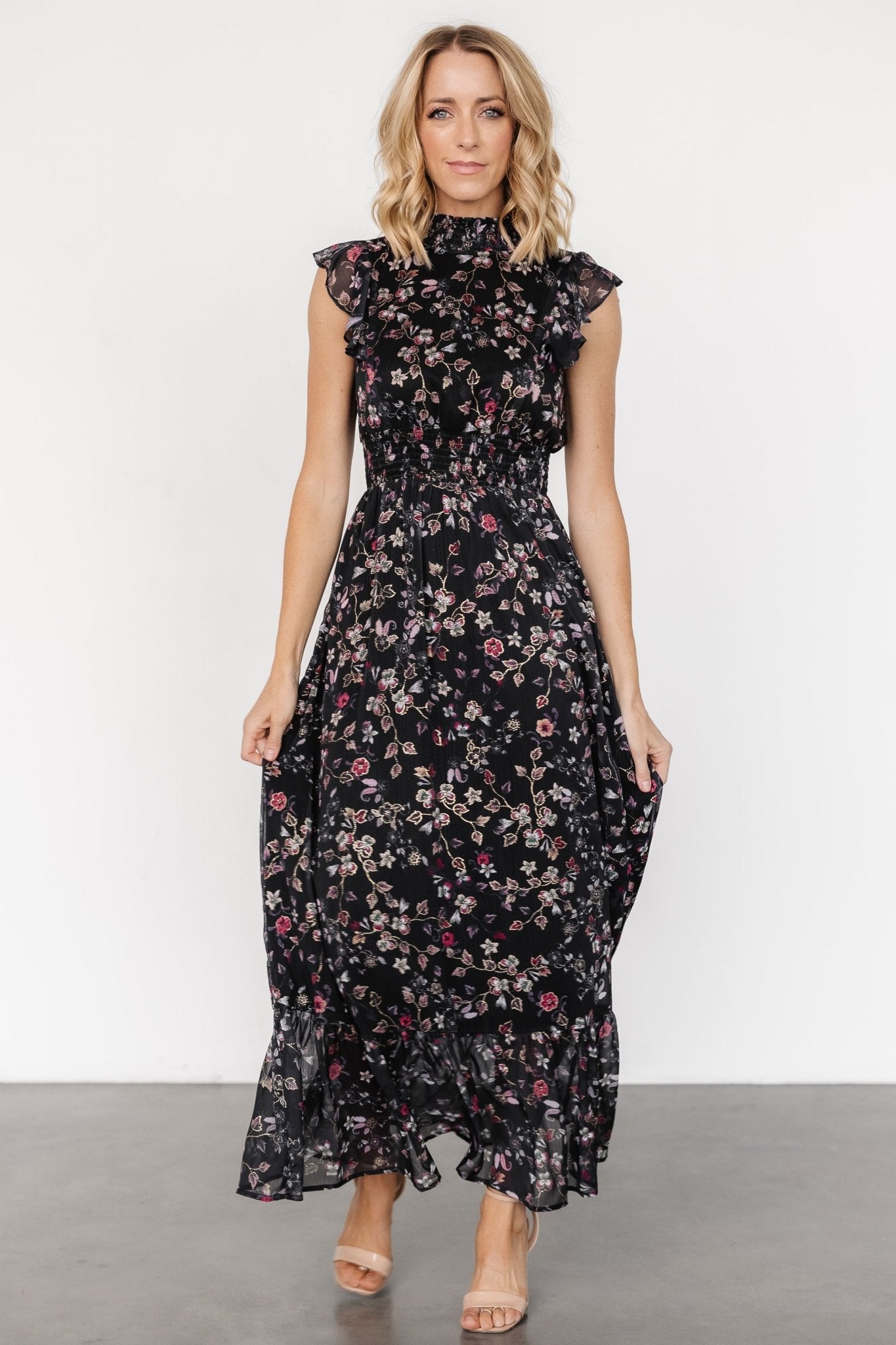 Detail close-up of the gold floral print and lightweight chiffon texture on the Kearny Ruffle Maxi Dress.