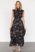 Detail close-up of the gold floral print and lightweight chiffon texture on the Kearny Ruffle Maxi Dress.