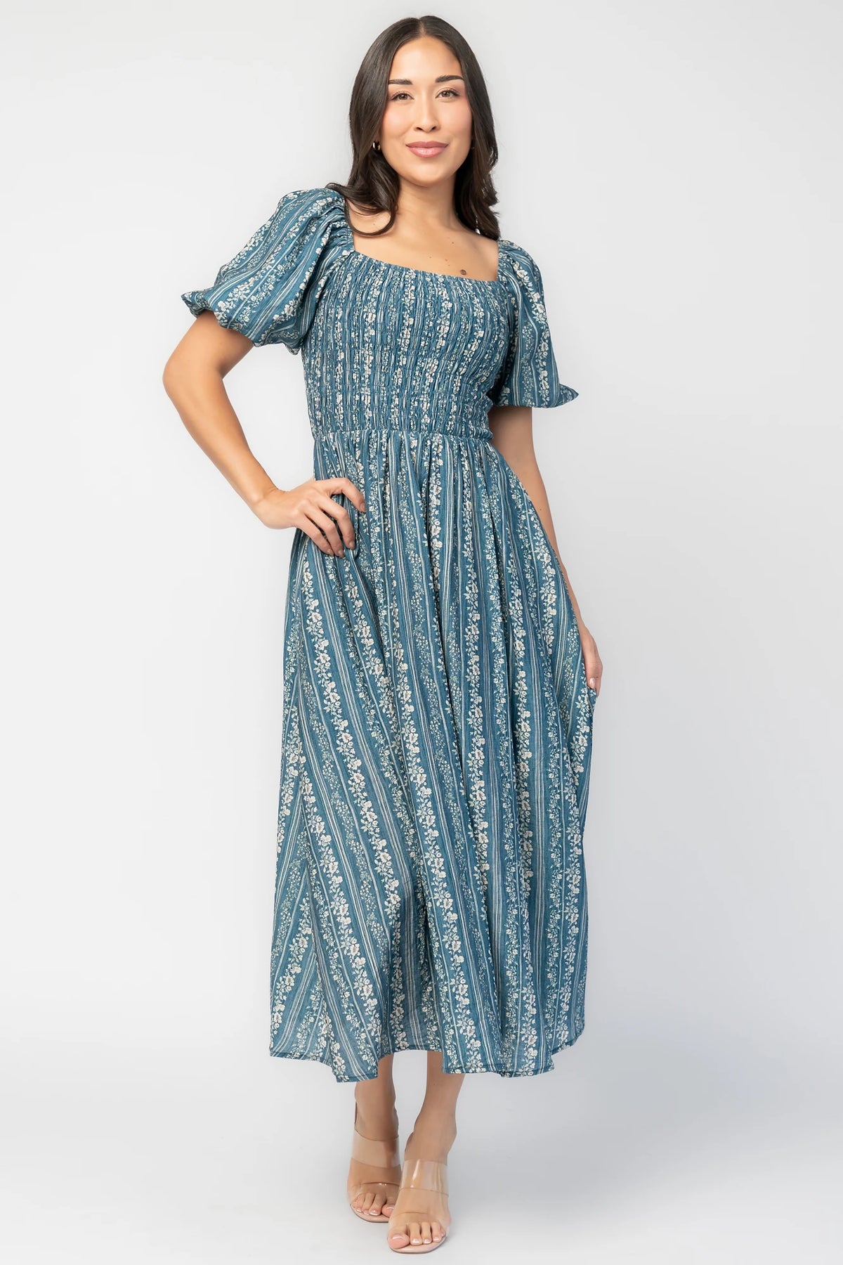 Keira Midi Dress in Blue Print with square neckline, smocked bodice, short puff sleeves, and midi skirt.