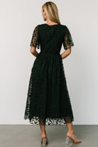 Detail of flutter-style tulle sleeve and embroidered floral motif on the Kendra dress, showing delicate texture and edge finish.
