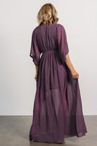Back view of the Kia Kimono Maxi Dress in vintage plum showing the relaxed kimono sleeves, gathered elastic waist, and long flowing hem.