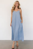 Front close-up of Kyla Maxi Dress showing V-neck, adjustable straps, lightweight lyocell denim texture and hidden side pocket detail.