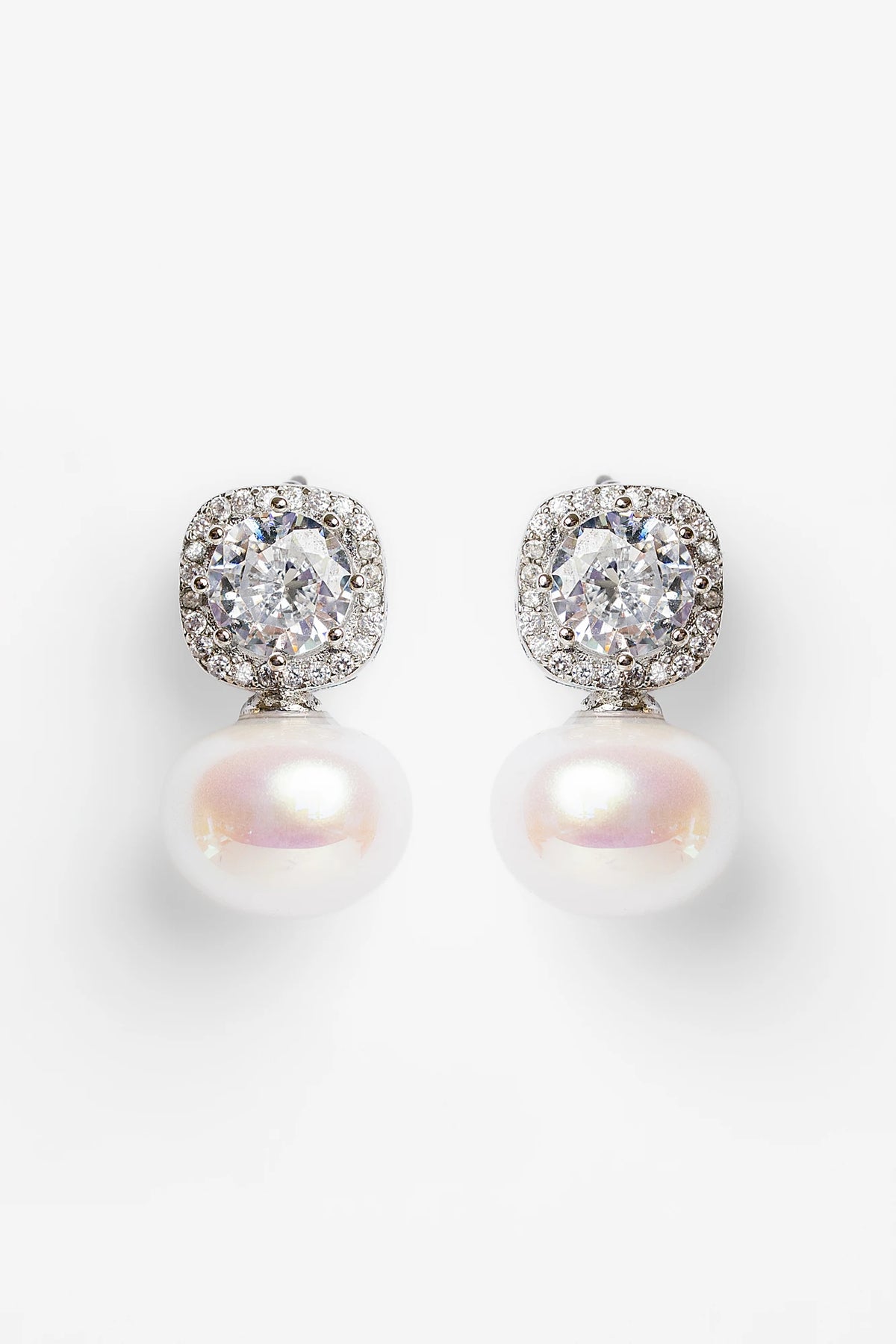 Laurent Pearl Halo Stud Earrings in Silver with cubic zirconia halo and faux pearl drop.