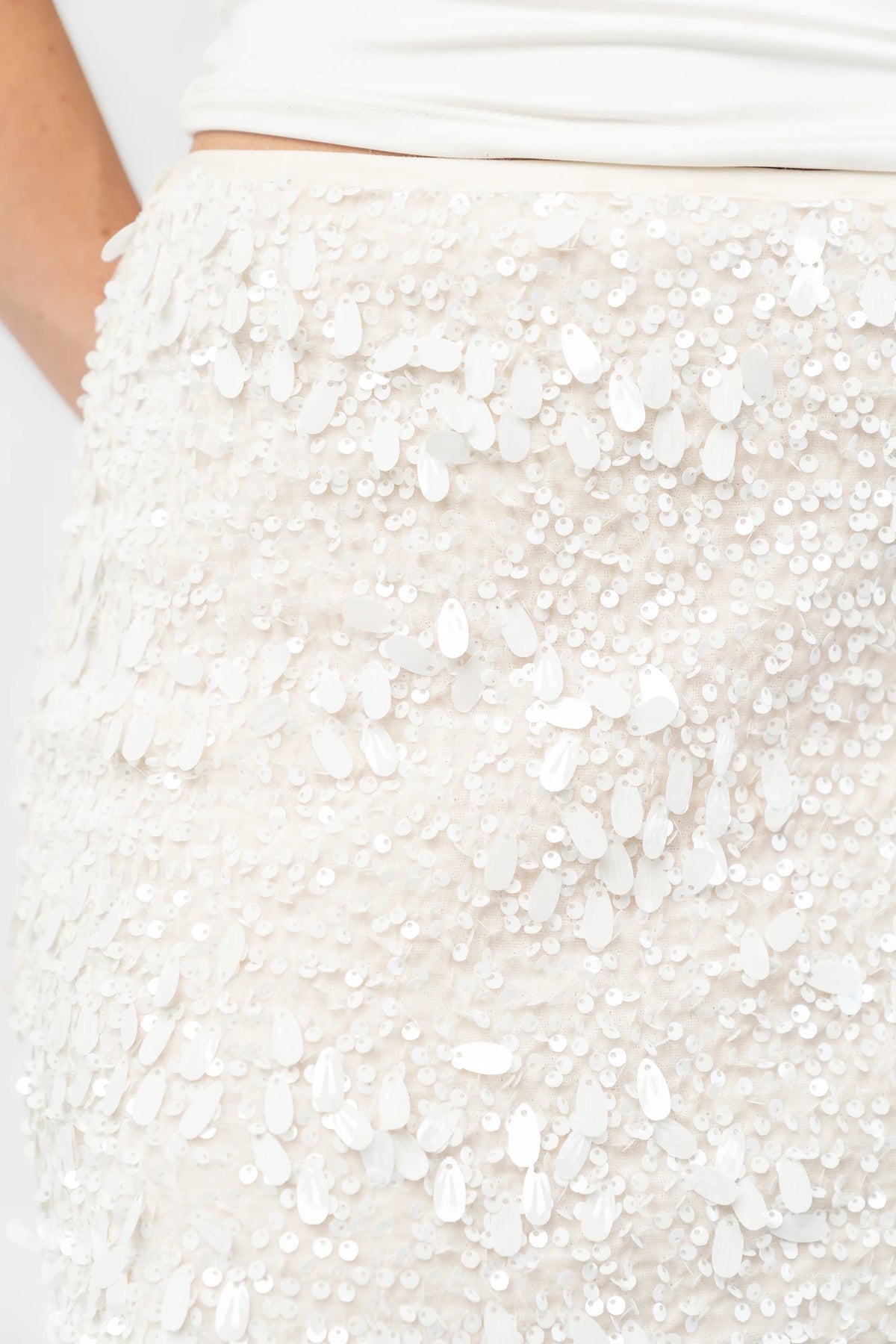 Lavana Sequin Skirt in Ivory with dimensional sequin embellishments, midi length, and fitted silhouette.