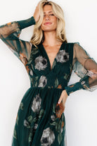 Front view of deep Topaz floral tulle maxi dress showing V-neckline, fitted smocked waist and floor-length flowing hem.