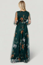Detail close-up of smocked waist and floral tulle fabric in deep Topaz green with delicate printed florals.