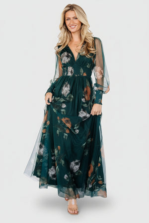 Long tulle maxi dress in deep Topaz green floral print with V-neckline, smocked waist, long sheer sleeves and flowing skirt.