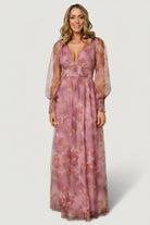 Back view of Layla Tulle Maxi Dress in Dusty Orchid Floral showing flowing skirt, gentle train, and overall silhouette in natural light.