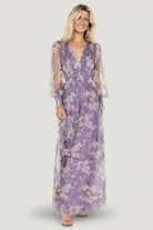 Front view of Layla Tulle Maxi Dress in lavender and blush floral showing deep V-neckline, fitted smocked waist, and flowing tulle skirt to the floor.