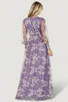 Three-quarter view of Layla Tulle Maxi Dress in lavender with blush florals, showing movement of layered tulle and raw hem finish.